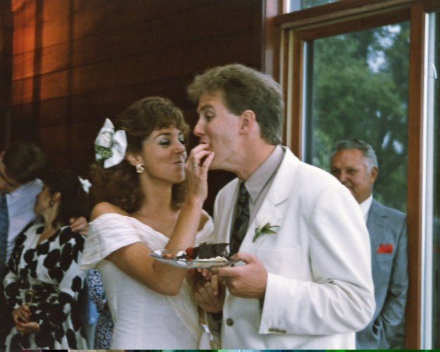 Enjoying some cake at the wedding